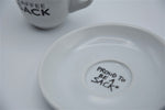 Espressotasse + Untertasse - Kaffeesack. Die Rösterei